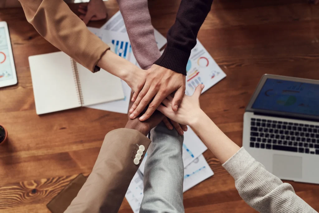 team joining hands