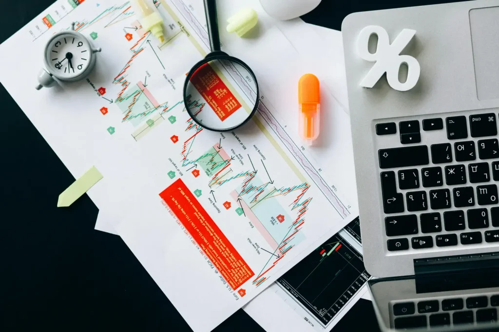 scattered business documents and charts, signifying the business risk management process