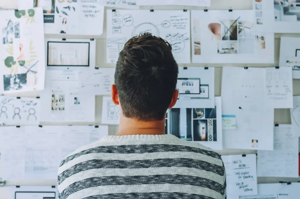 man looking at charts and graphs to help him make a rational decision