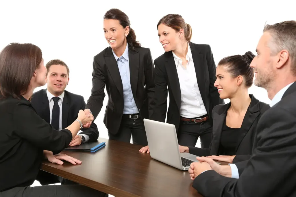 businessmen in a room agreeing to buy a small business