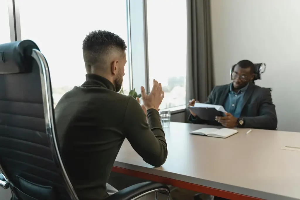 leader discussing hiring practices with team member