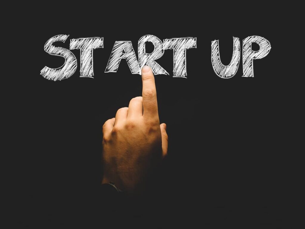 a hand pointing to the word "start up"
