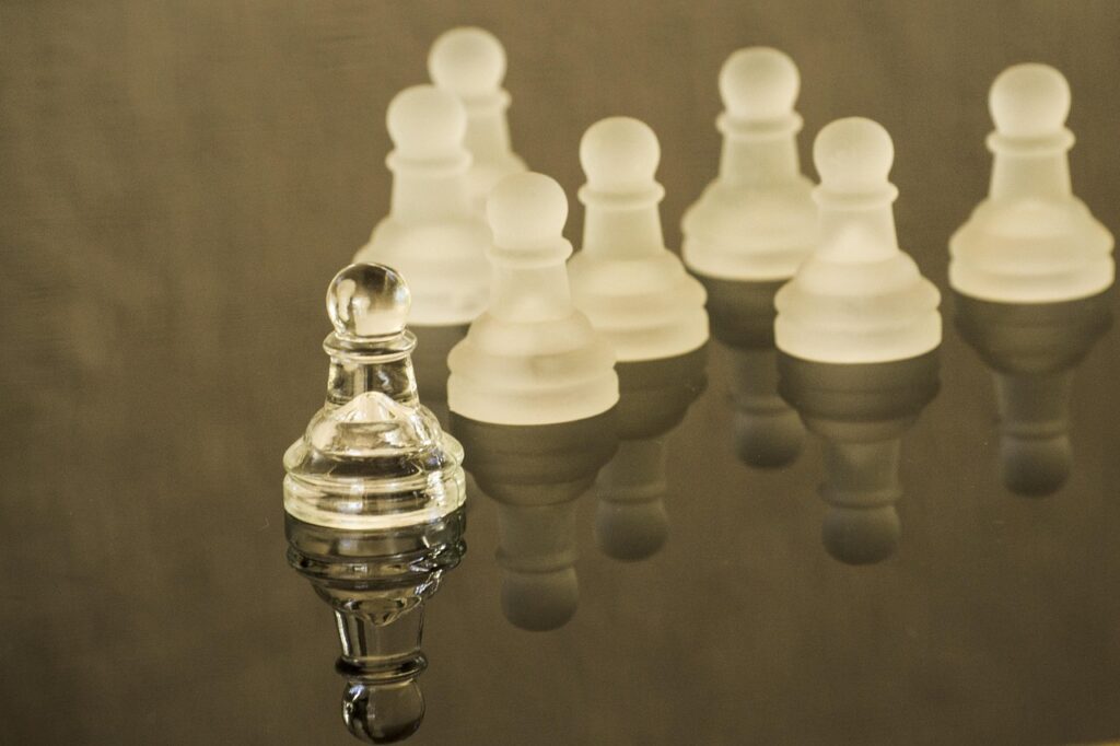 small chess pieces following a chess piece at the front, symbolizing good leadership