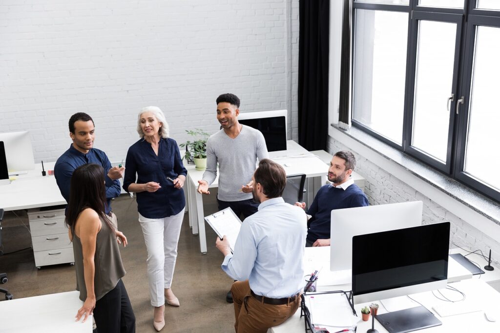 team members working harmoniously with their self-aware leader